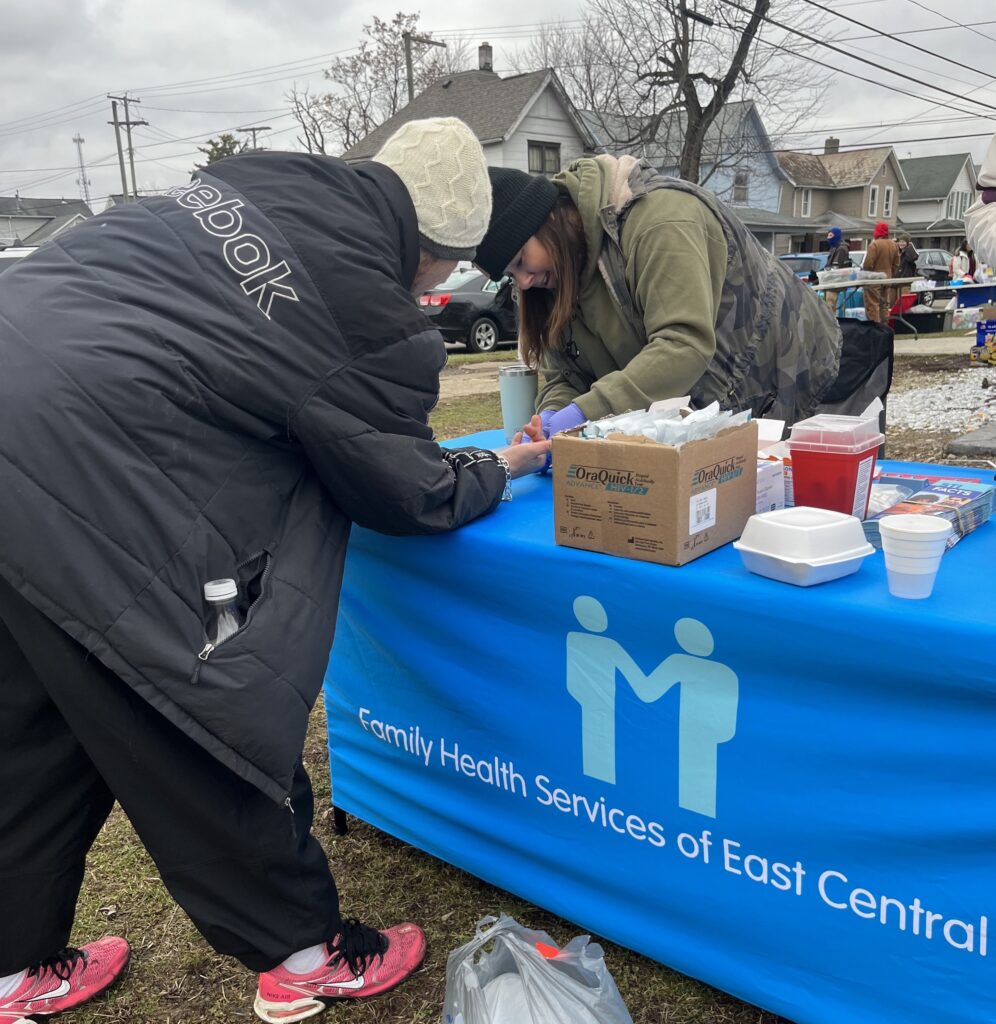 Volunteers bring vaccines, virus tests to Newark area residents facing